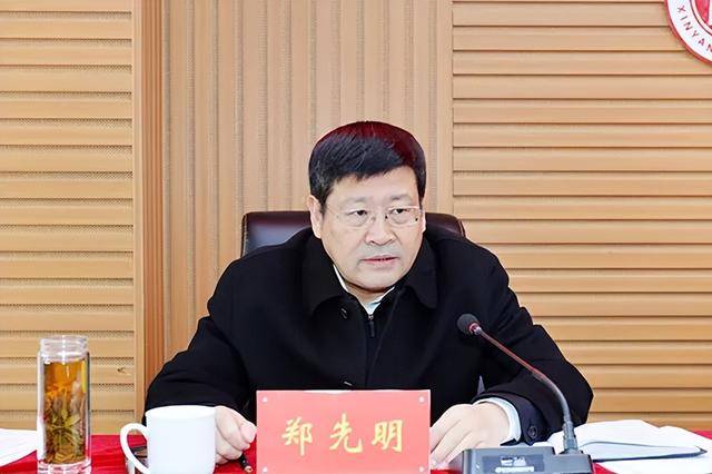 郑先明，主动投案